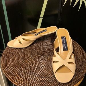 A tan colour open toe leather slippers by Etienne Aigner in size 7.5